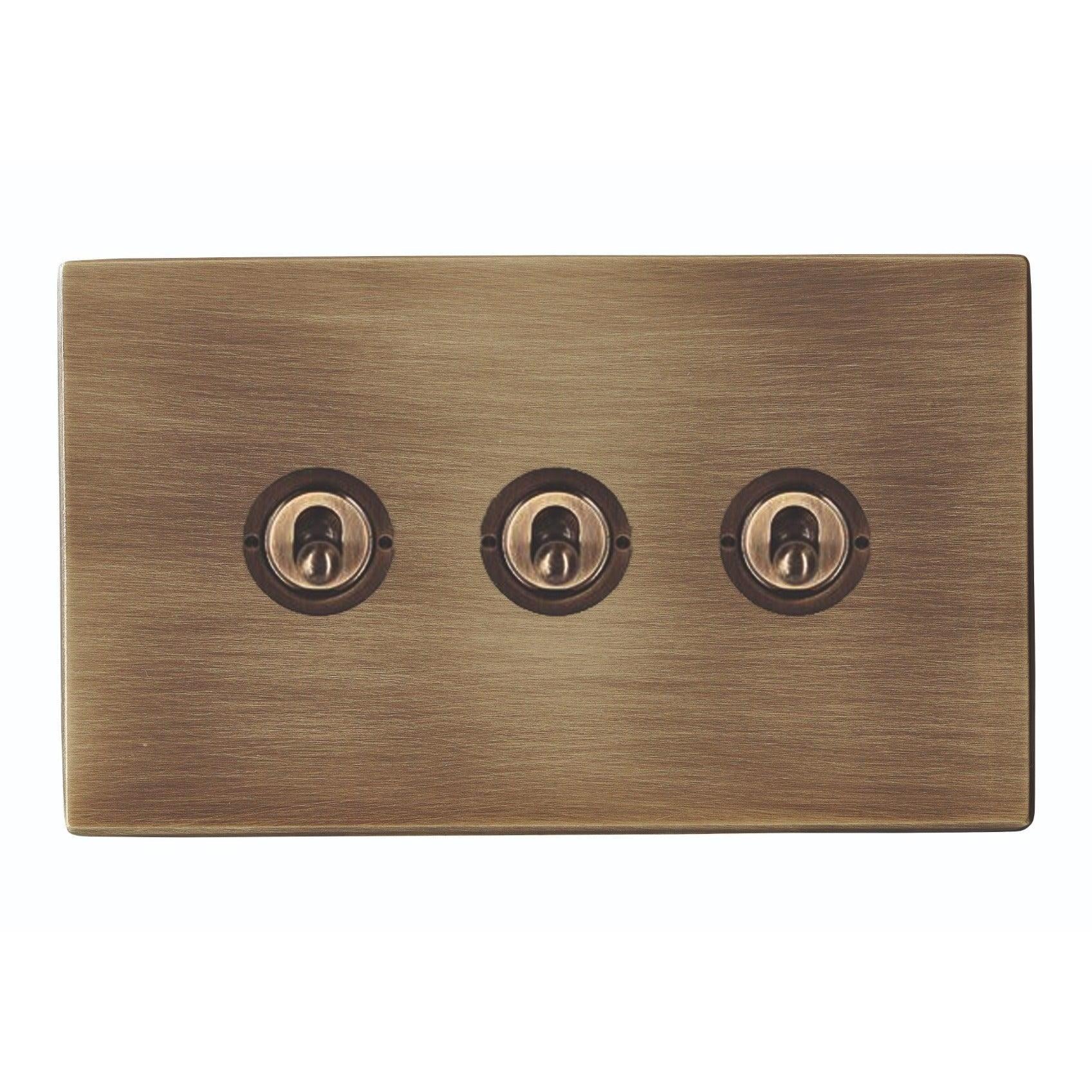 Hartland G2 7G29T23 3 gang 20AX 2 Way FL Toggle Antique Brass with Antique Brass Inserts